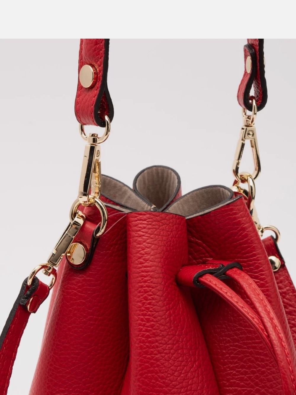 Women’s Red Leather Drawstring Shoulder Bag with Gold Hardware